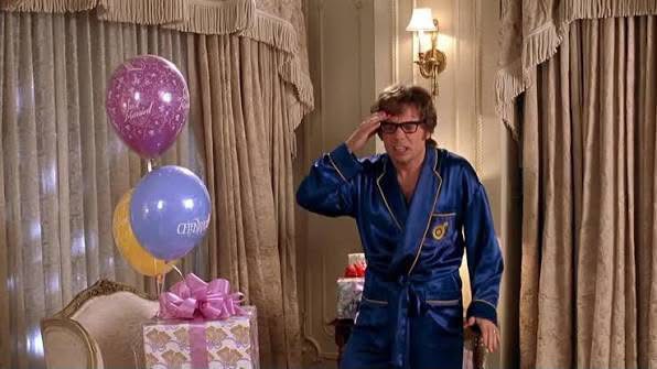 Austin Powers in a blue robe meme template