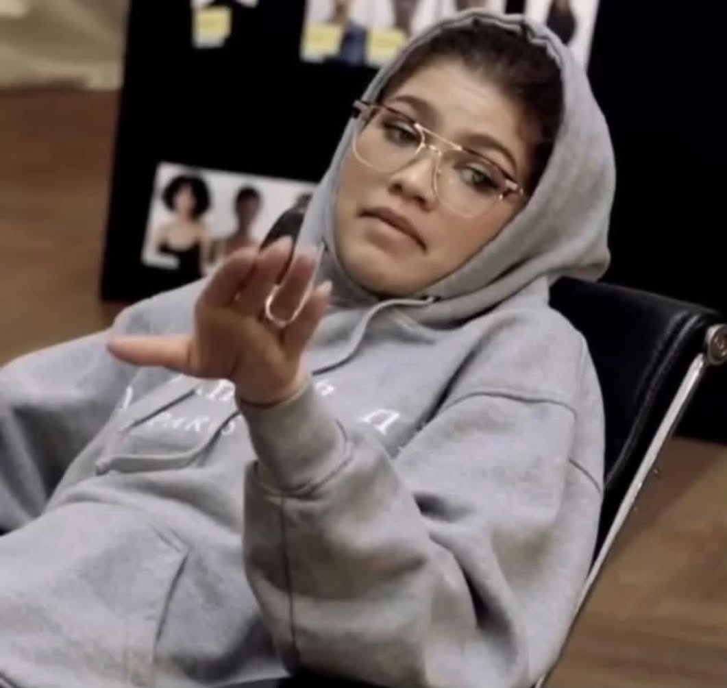 Zendaya dismissive hand-raise meme template — face swap your selfie into it with YouInMeme